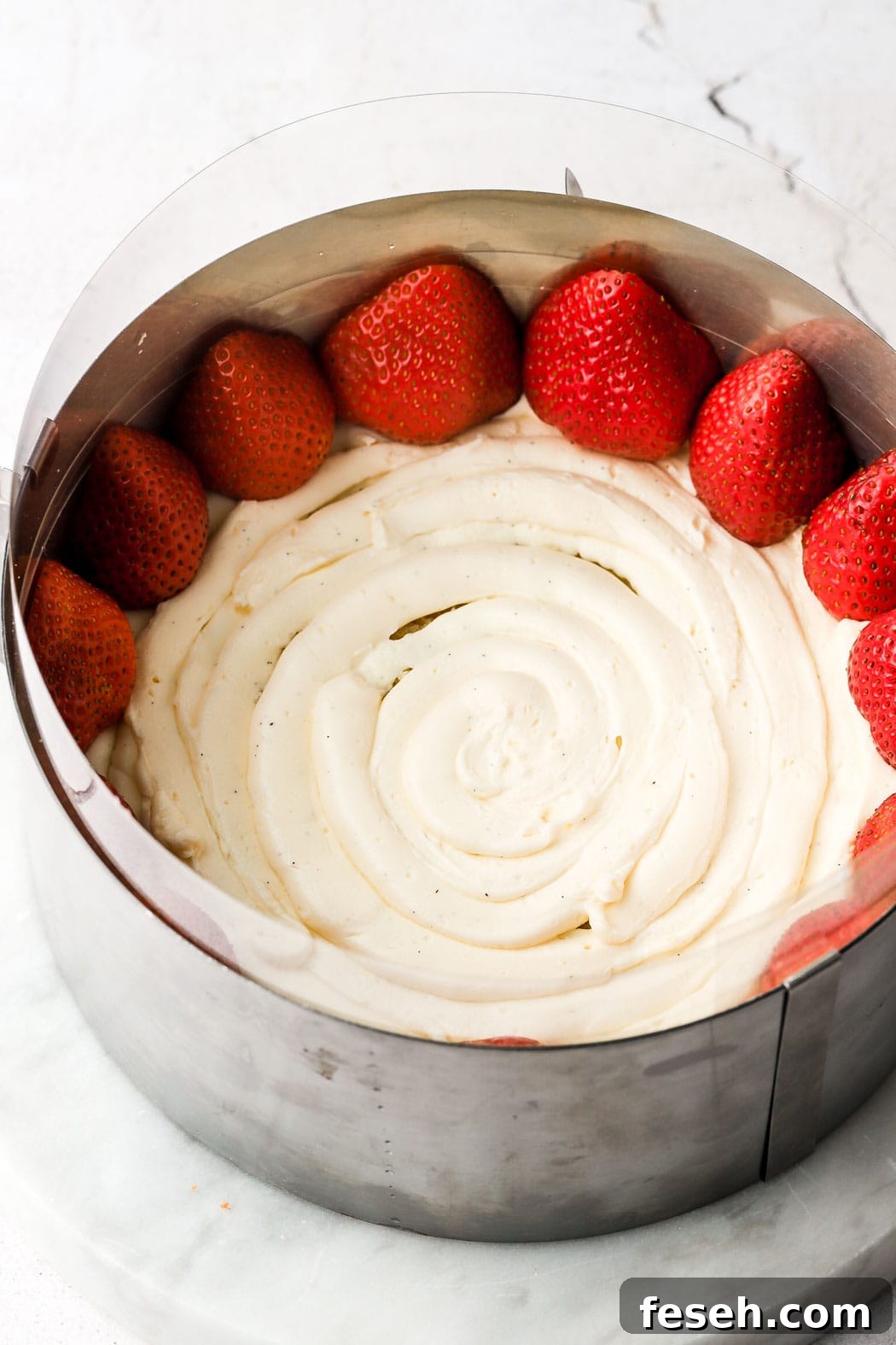 thin layer of crème mousseline and strawberry halves along the edge