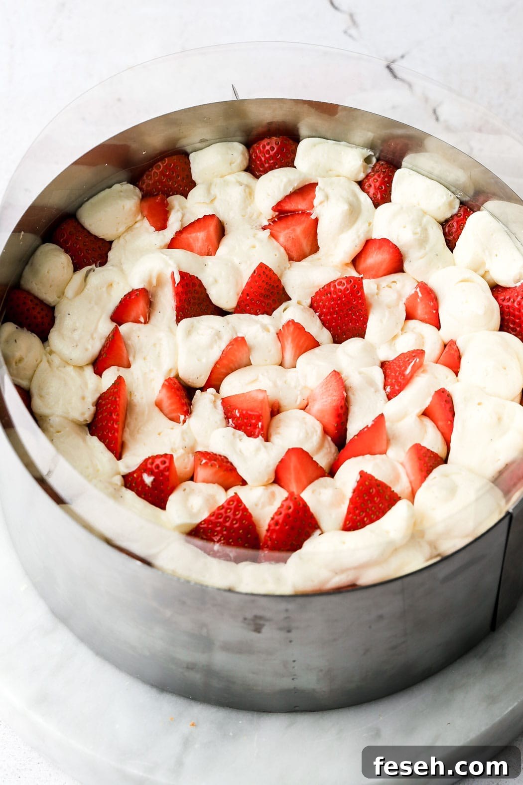 fill in the center with more strawberry slices and fill in empty spaces with cream