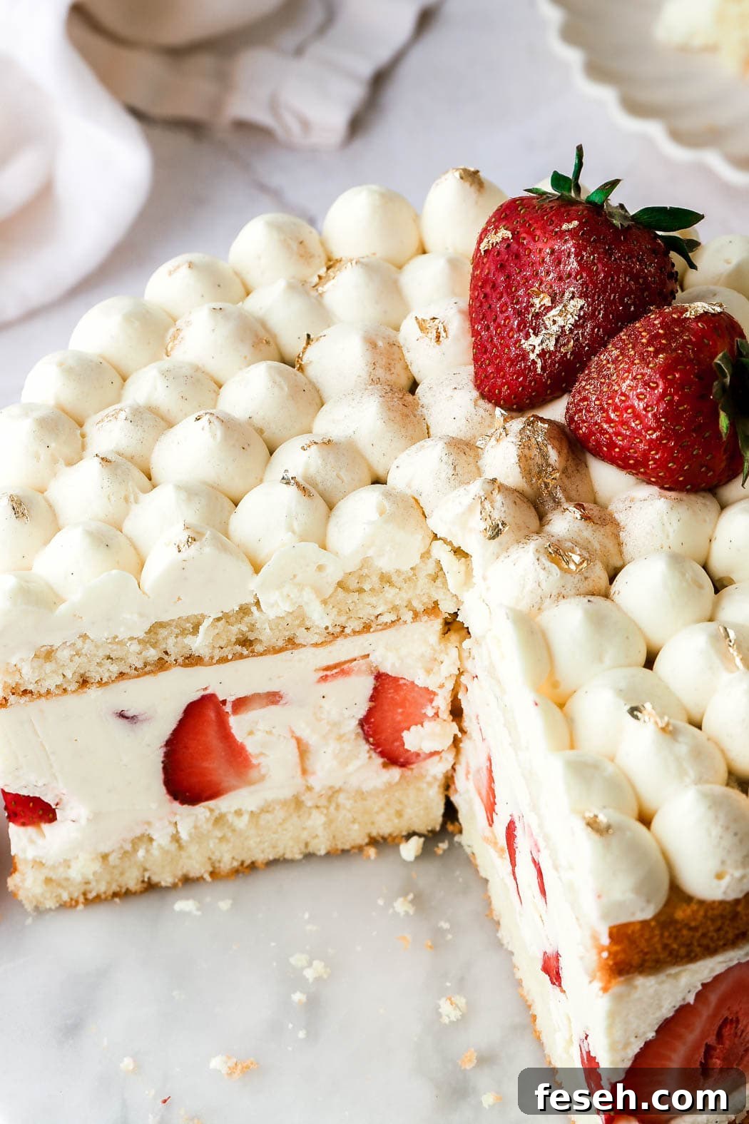 top with more strawberries and gold foil/gold flakes