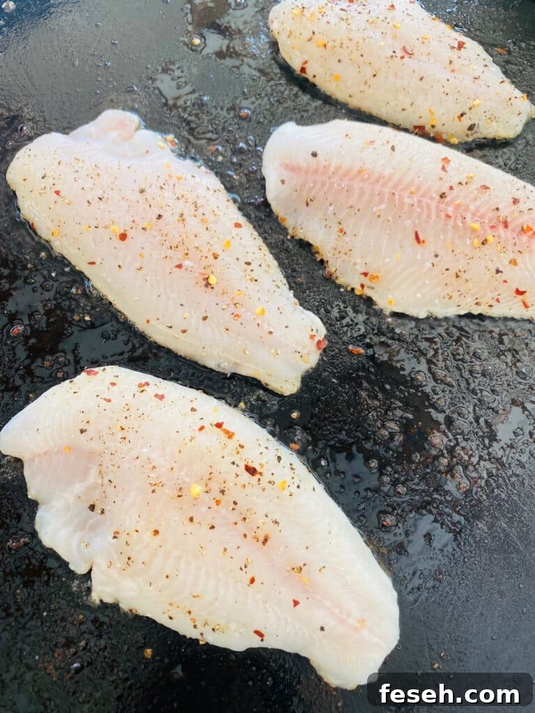 catfish on the griddle before cooking