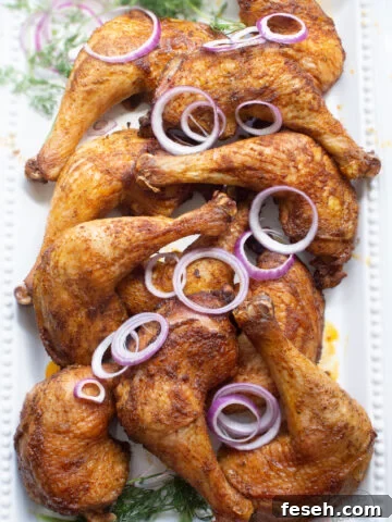 chicken leg quarters with sliced purple onions and dill