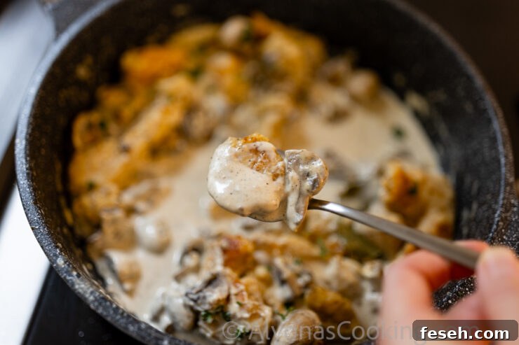 image of smothered chicken in a rich whole mushroom gravy 