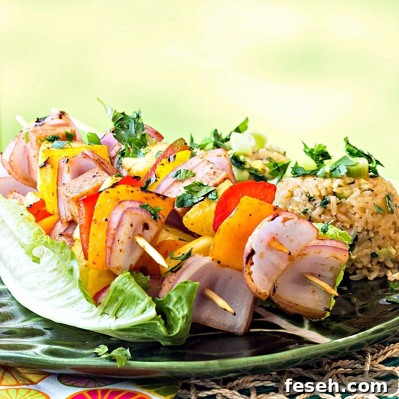 Bring the luau to your home with my Hawaiian Pineapple Ham Skewers with Sweet and Hot Pineapple Rice featuring Tracy's Gourmet Aloha Kick Dressing and Marinade!
