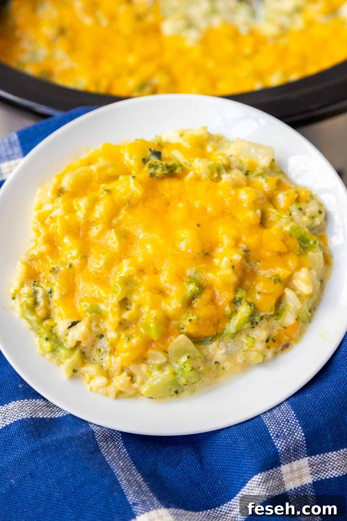 Crockpot Broccoli Rice Casserole topped with melted cheddar.