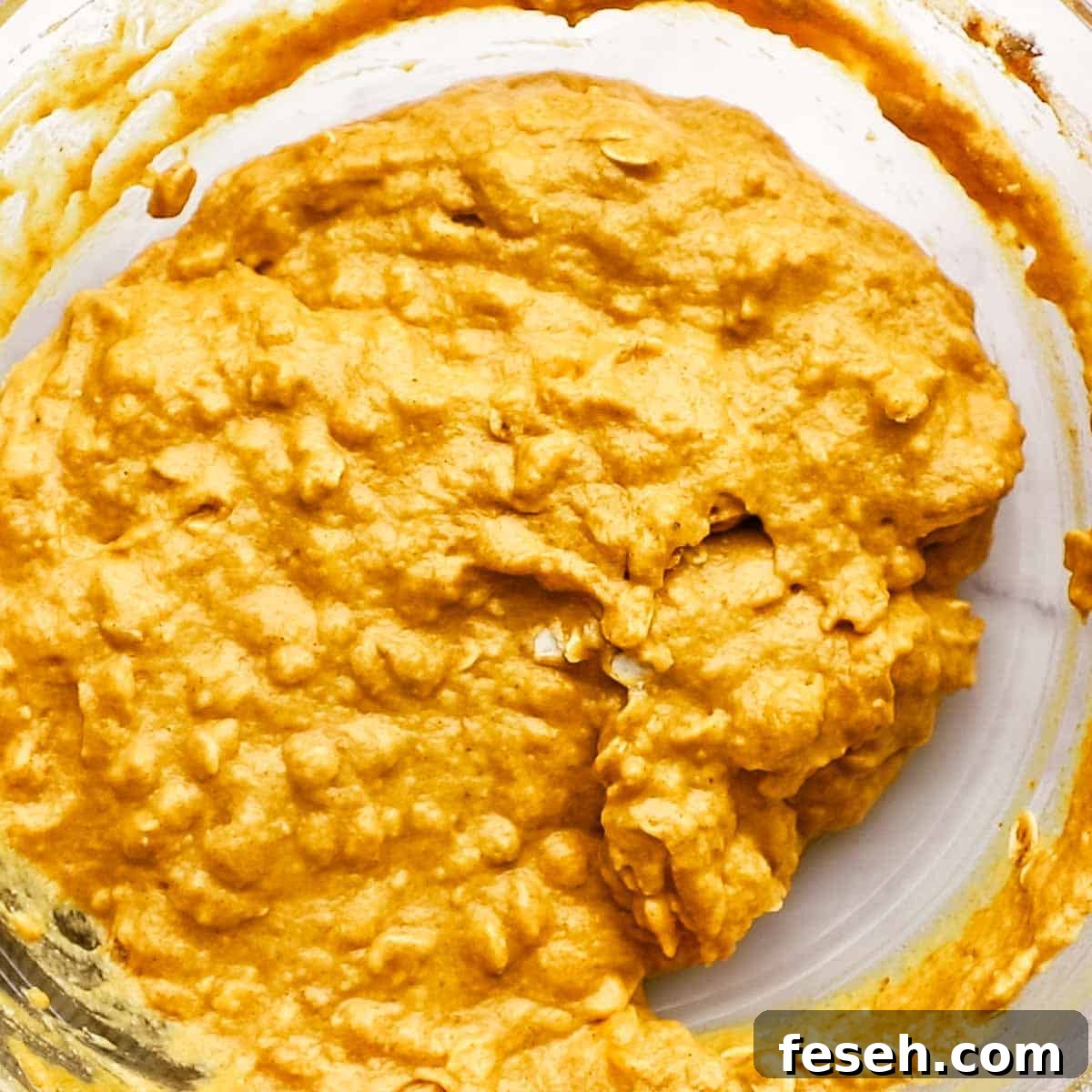 whisked muffin batter in a large bowl