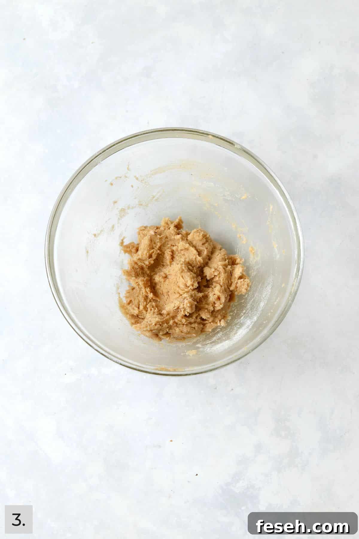 Single serve cookie dough in a mixing bowl before mix-ins are added.