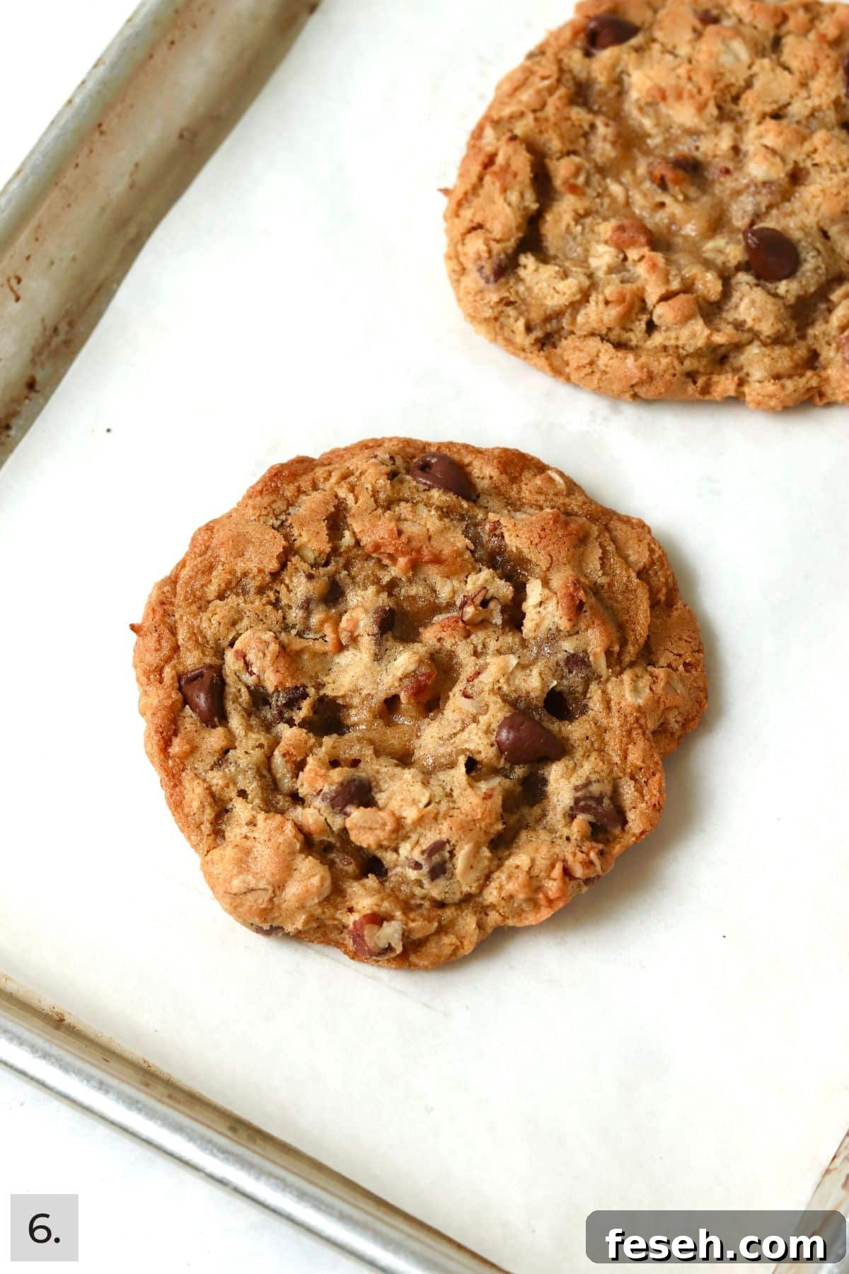 Baked single serve cowboy cookie on a baking sheet.