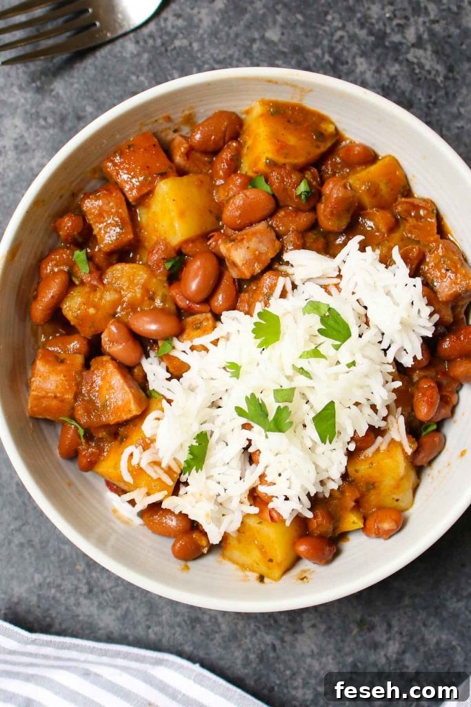 Puerto Rican Rice and Beans are saucy, flavorful, and comforting. Delicious Goya red beans are simmered in sofrito, tomato and sazon sauce! This Puerto Rican staple is also known as Habichuelas or stewed beans, and leftovers are perfect for meal prep.
