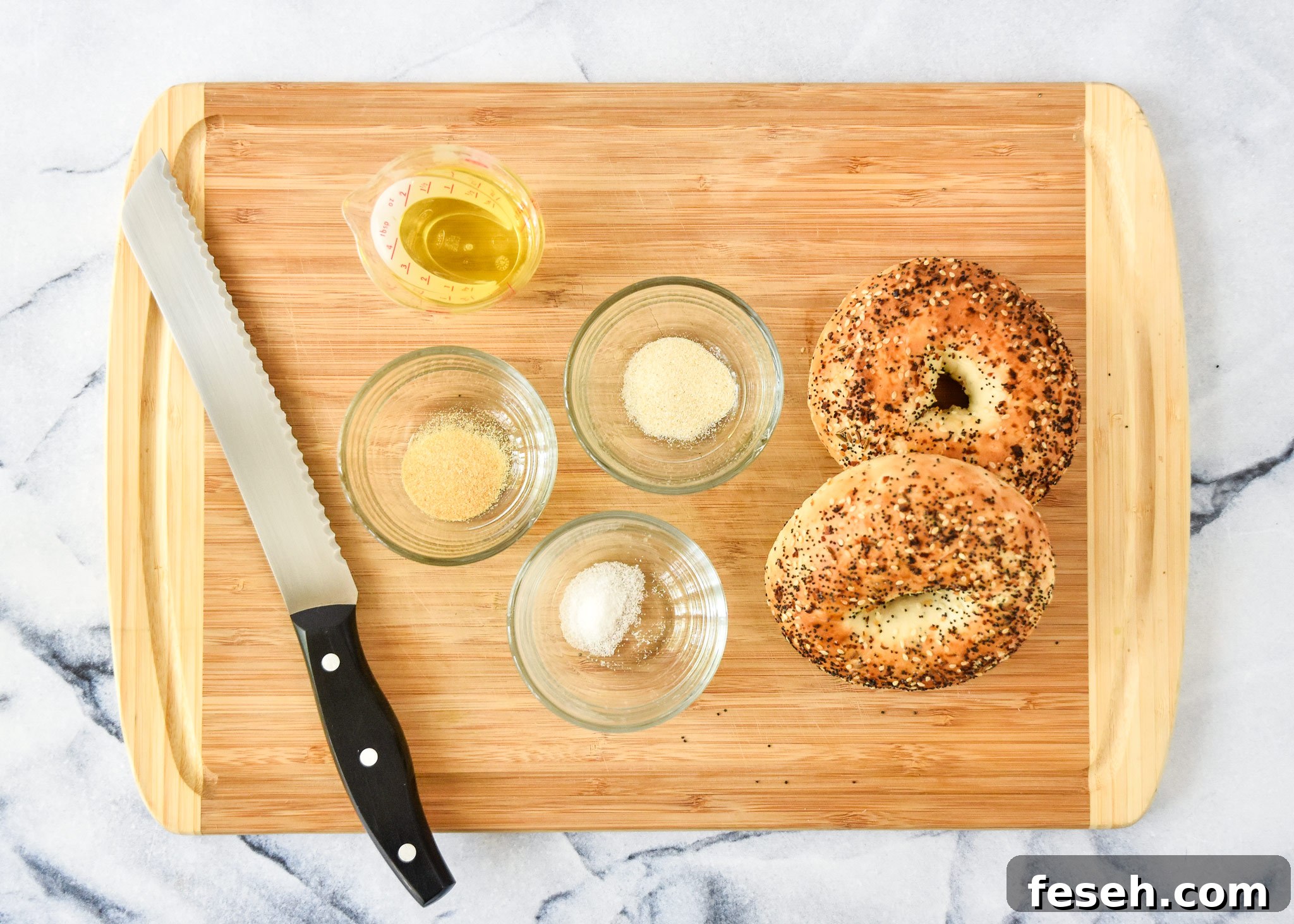 ingredients for the air fryer everything bagel chips on a cutting board.