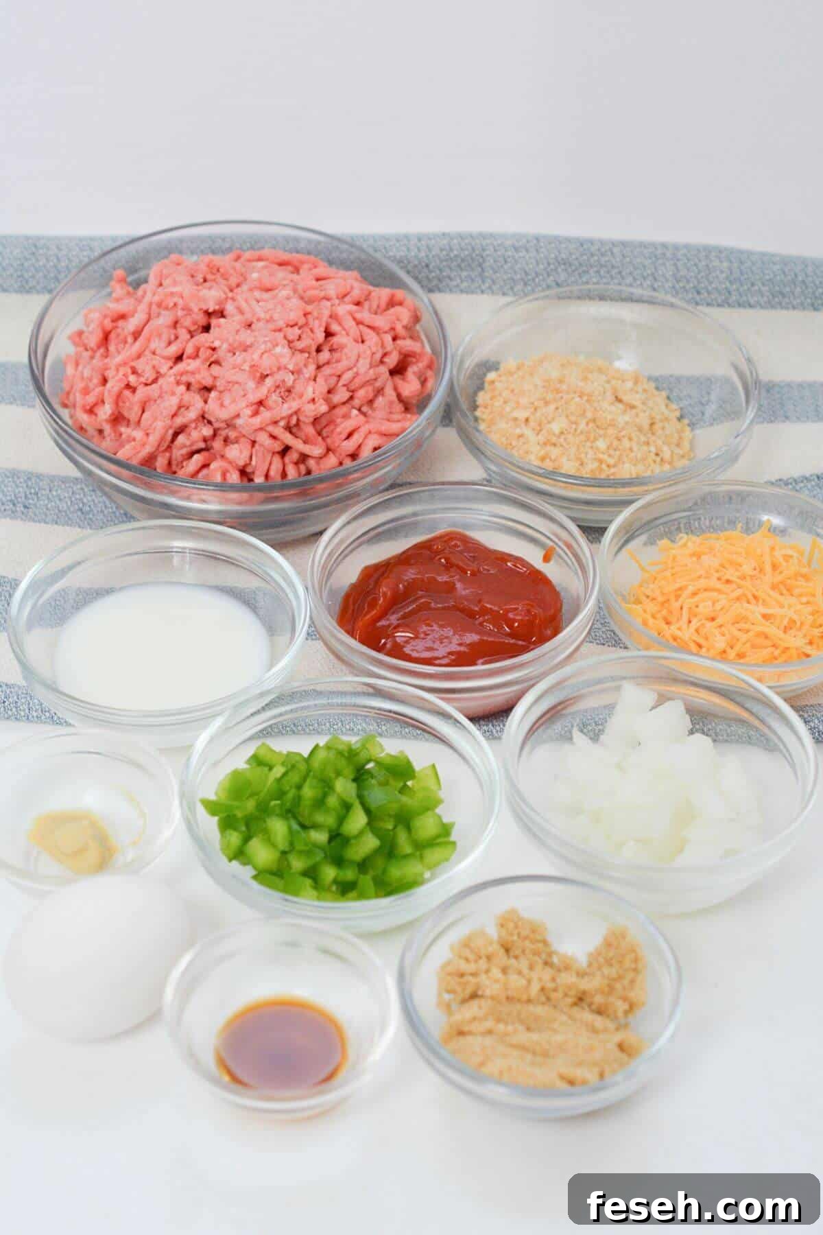 Ingredients for copycat Cracker Barrel Meatloaf in bowls on a table.