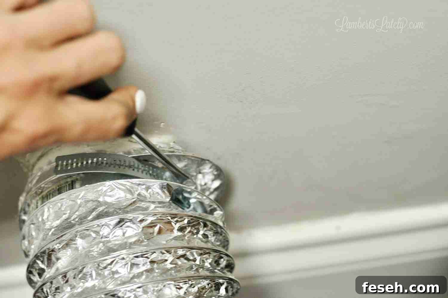 disconnecting a dryer vent hose from the wall