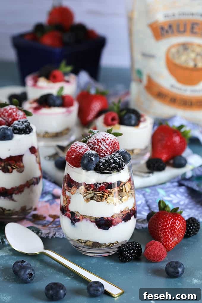 No Bake Cheesecake Breakfast Parfait with a white spoon and a bag of muesli in the background from TheSuburbanSoapbox.com