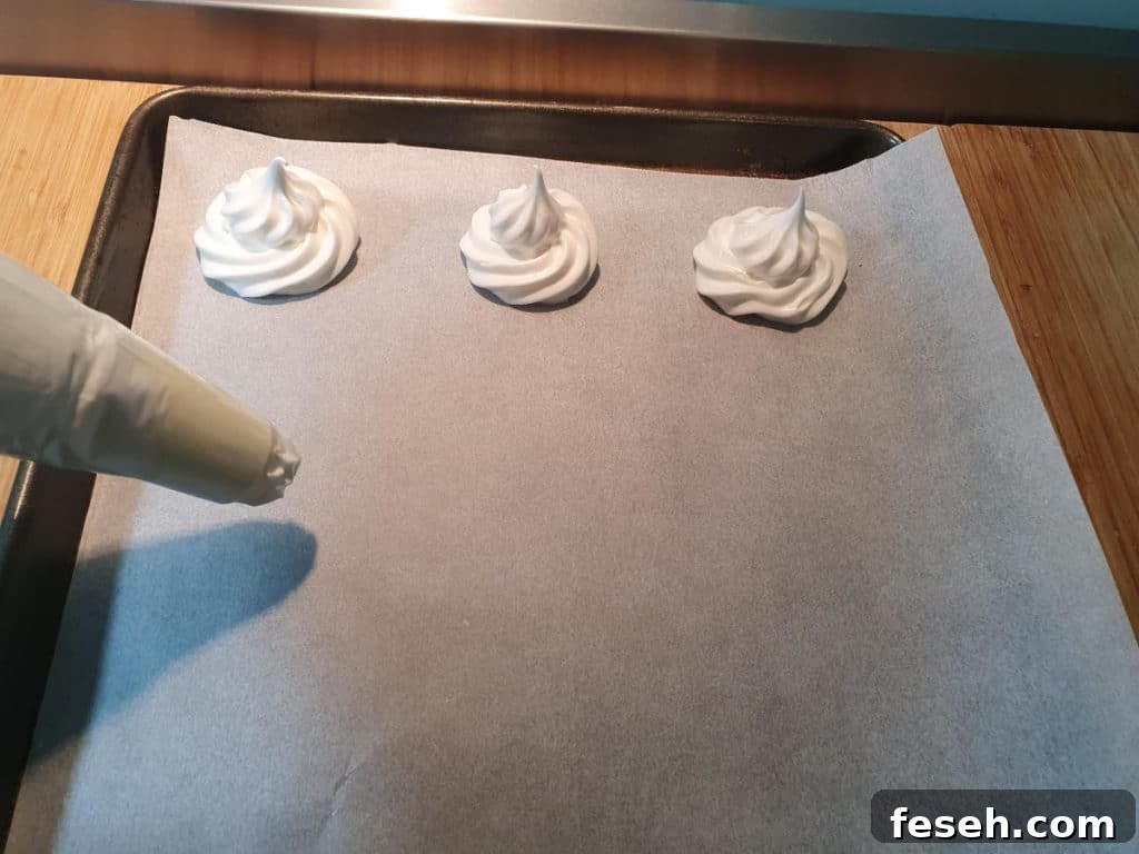 Pipping meringues onto baking tray