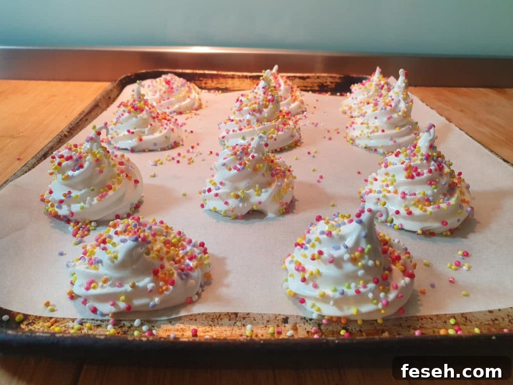 Meringues with sprinkles ready to bake