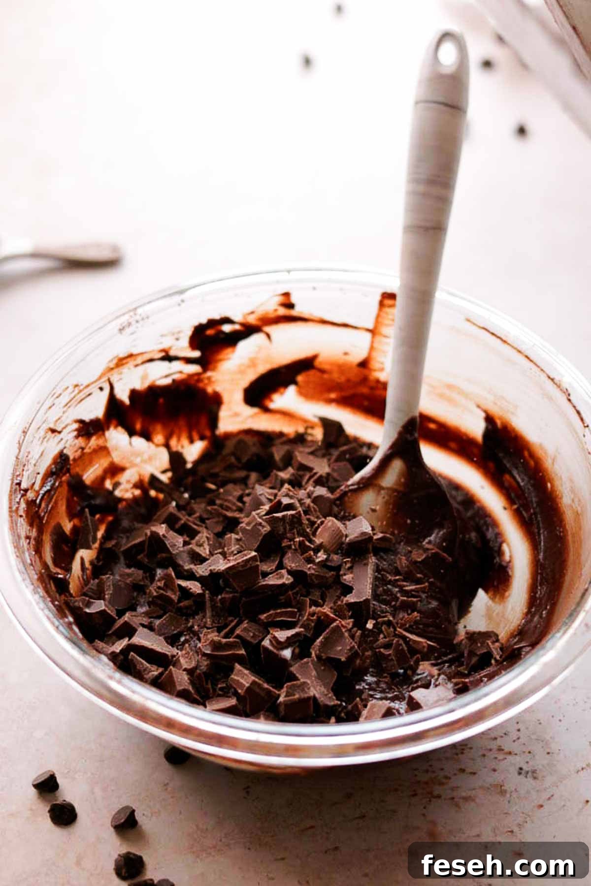 chocolate chips being added to to brownie batter