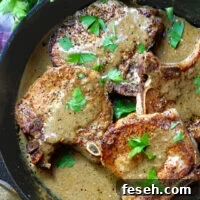 Pork Chops & Mustard Cream Sauce in a cast iron skillet