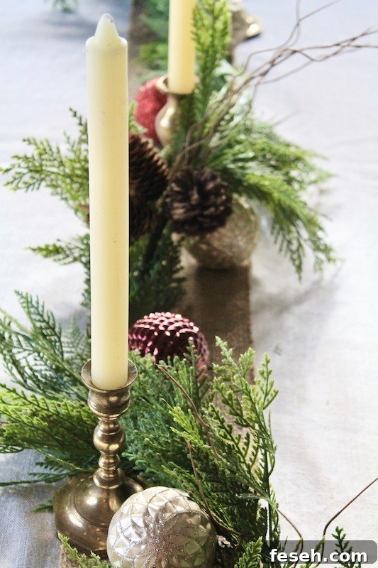 evergreen garland with ornaments on table