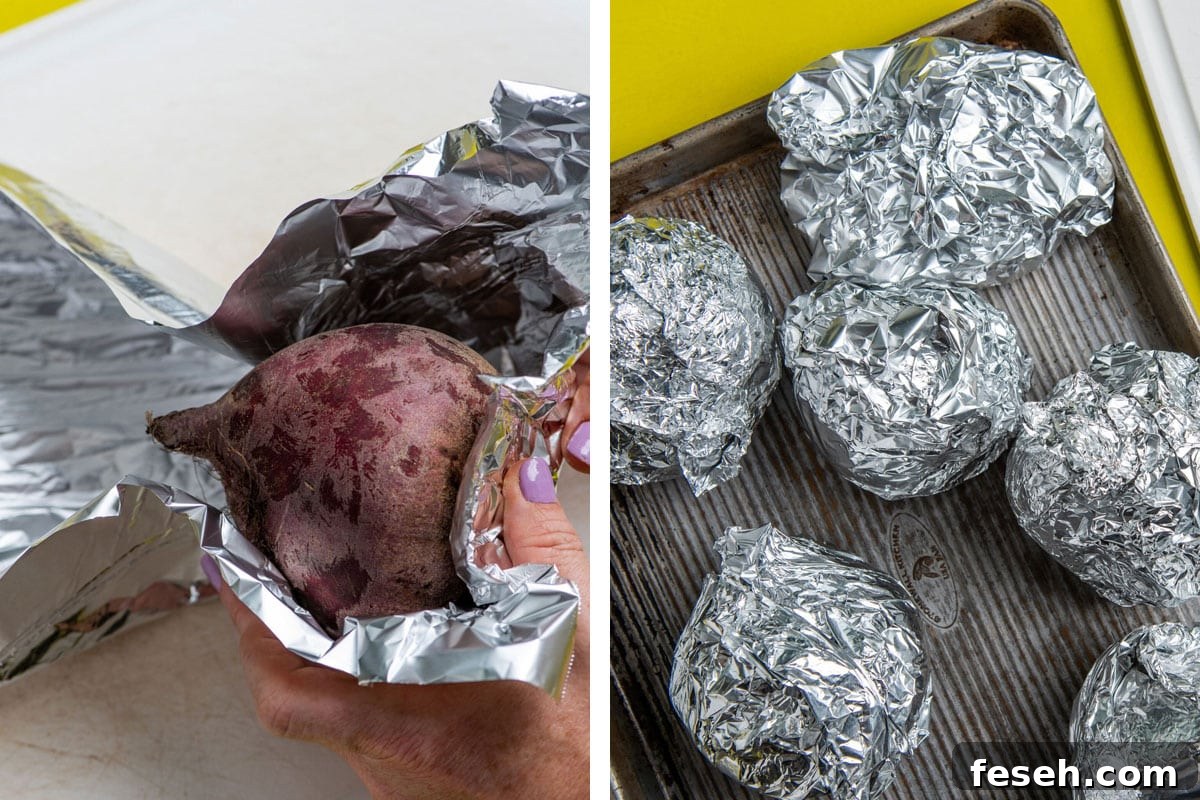 Wrapping red beets in foil and piling on baking sheet.
