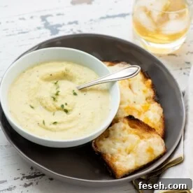 Plate with cheese toasts and a bowl of Parsnip and Golden Beet Soup.