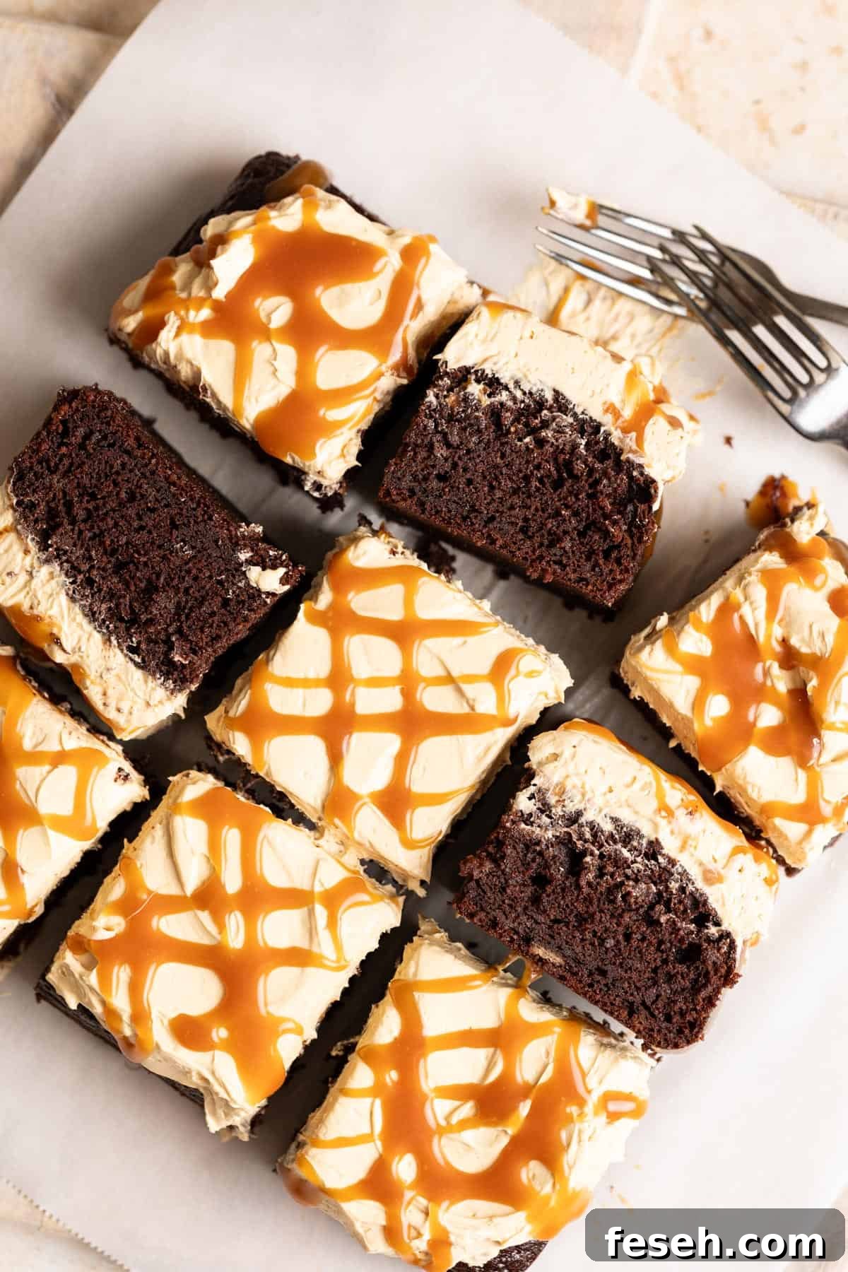 Slices of chocolate banana cake with miso caramel frosting with some slices tipped on their sides.