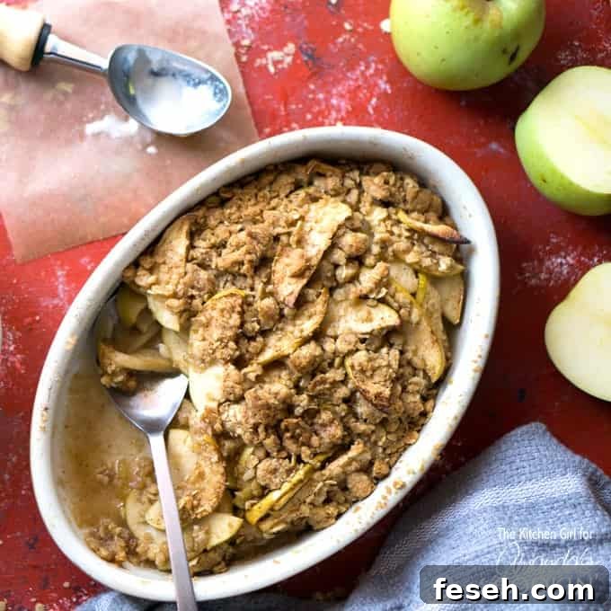 apple crisp in dish with a spoon