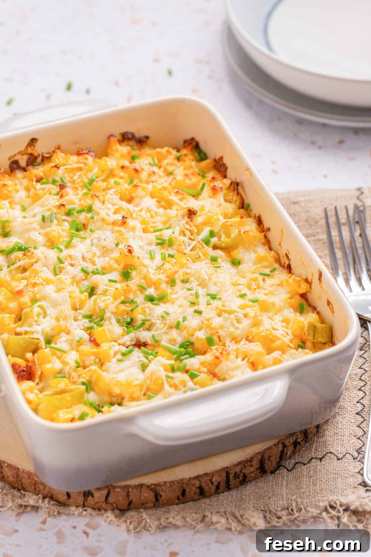 An image of corn casserole with cream cheese, ready to be served. 