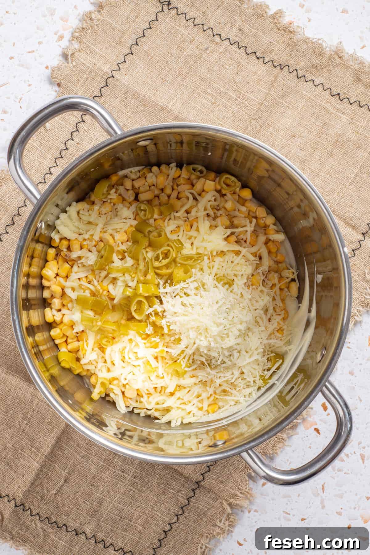 An image of the ingredients of cream casseroel combining into a saucepan