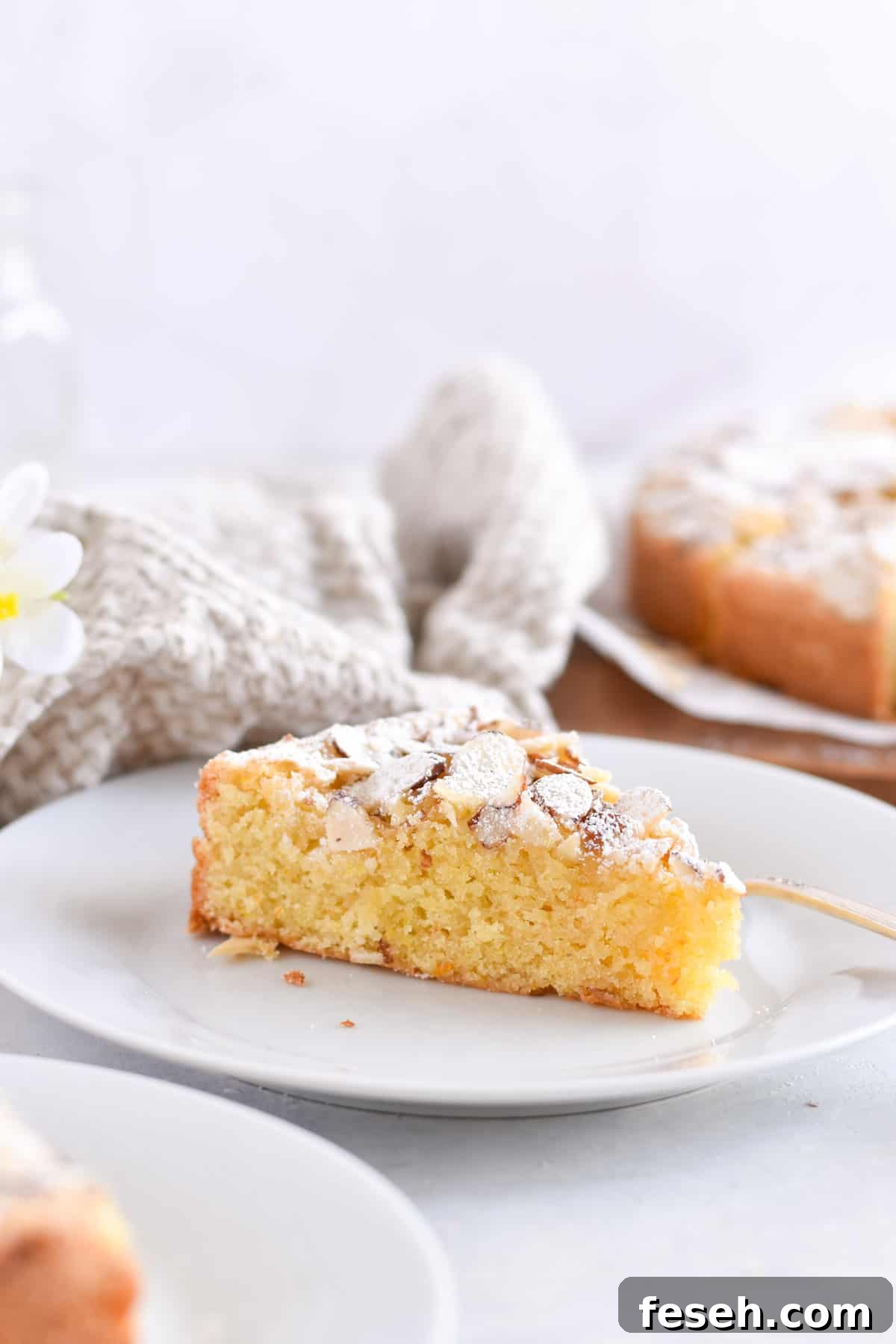 slice of italian almond cake on white plate.