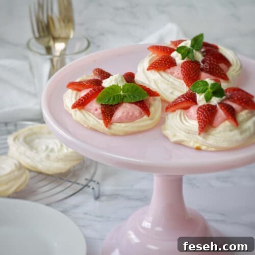 3 small meringue shells filled with strawberry mousse