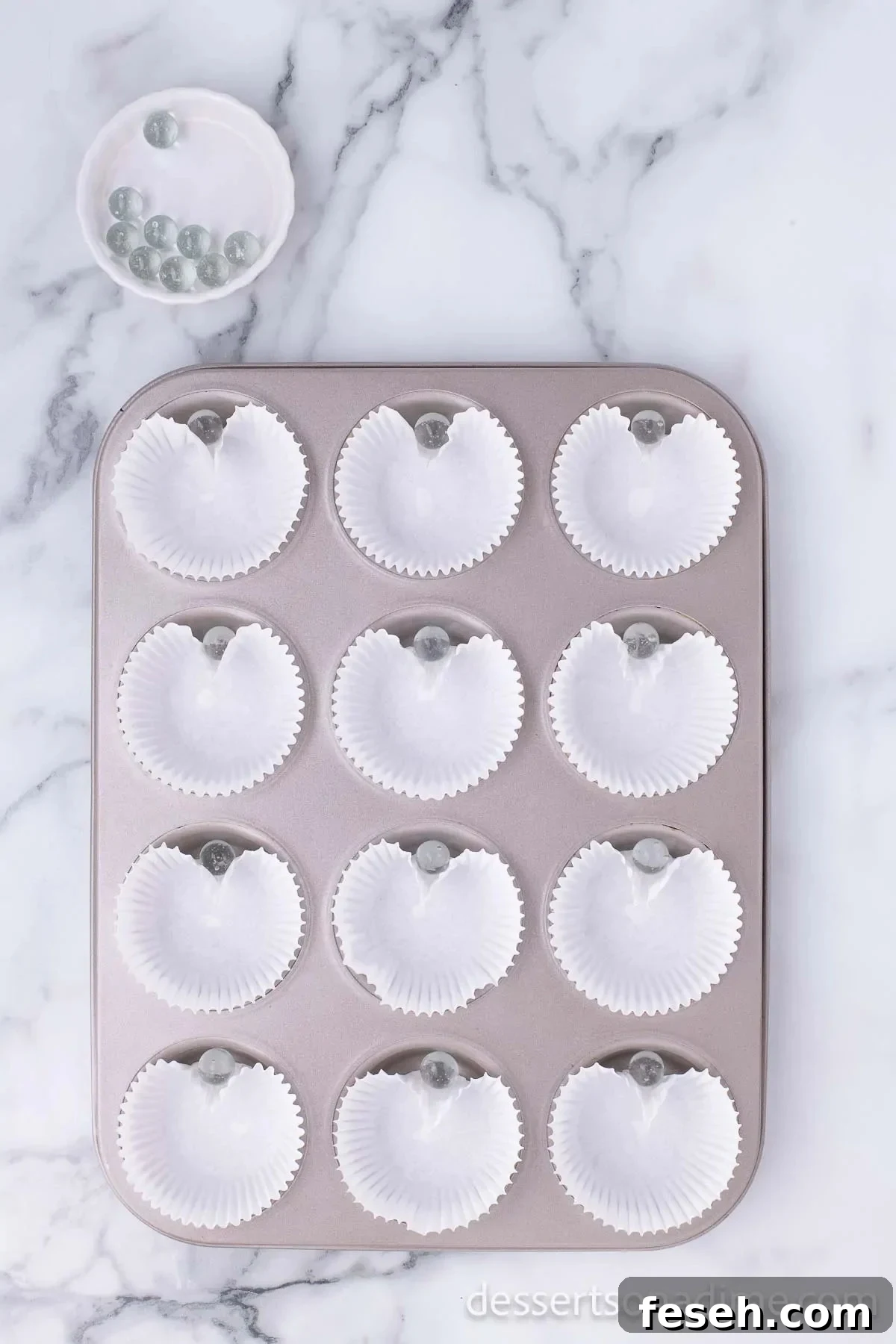 Liners in pan with a marble.