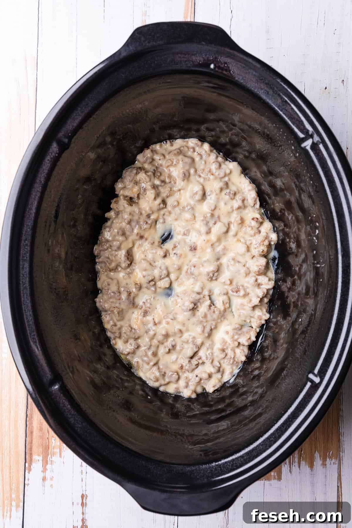 A layer of gravy in the crockpot.