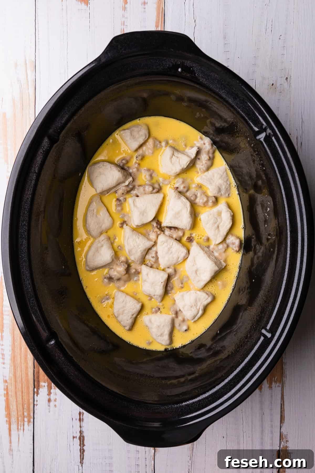 Adding the second layer of biscuits.