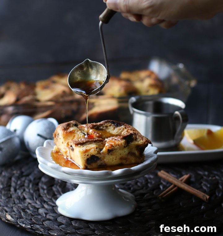pouring syrup over a square piece of overnight panettone French toast