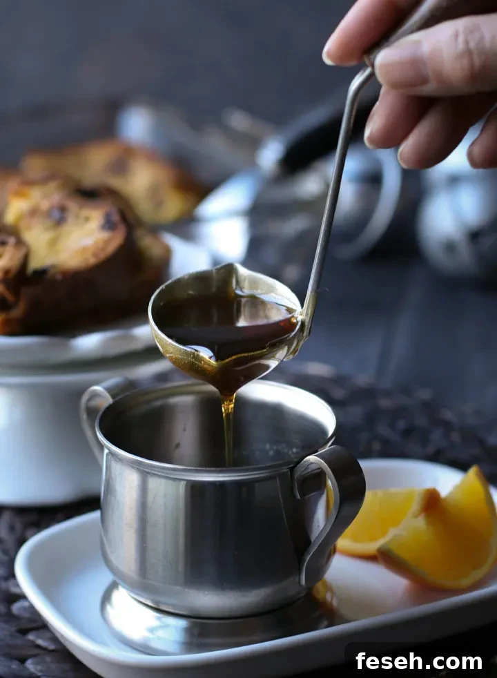 a small ladle full of orange spiced maple syrup