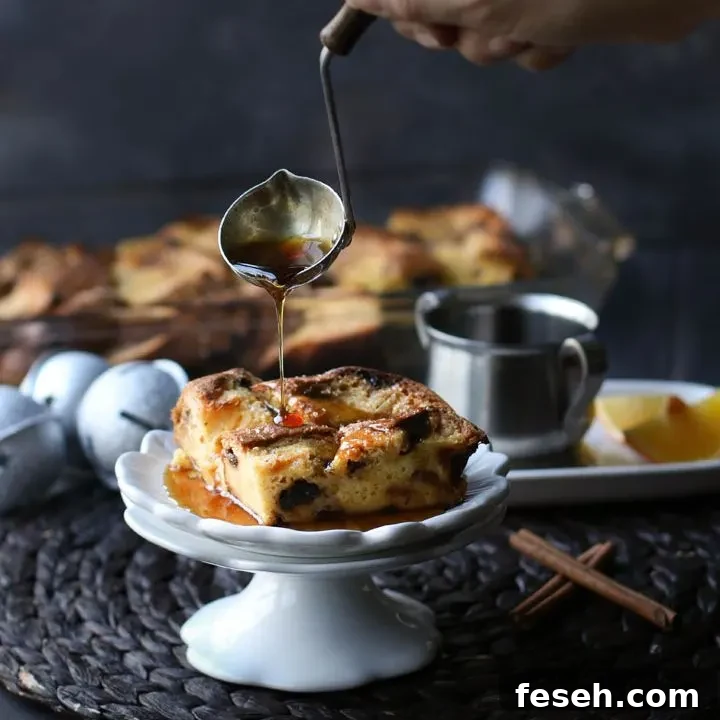 pouring syrup over a square piece of overnight panettone French toast