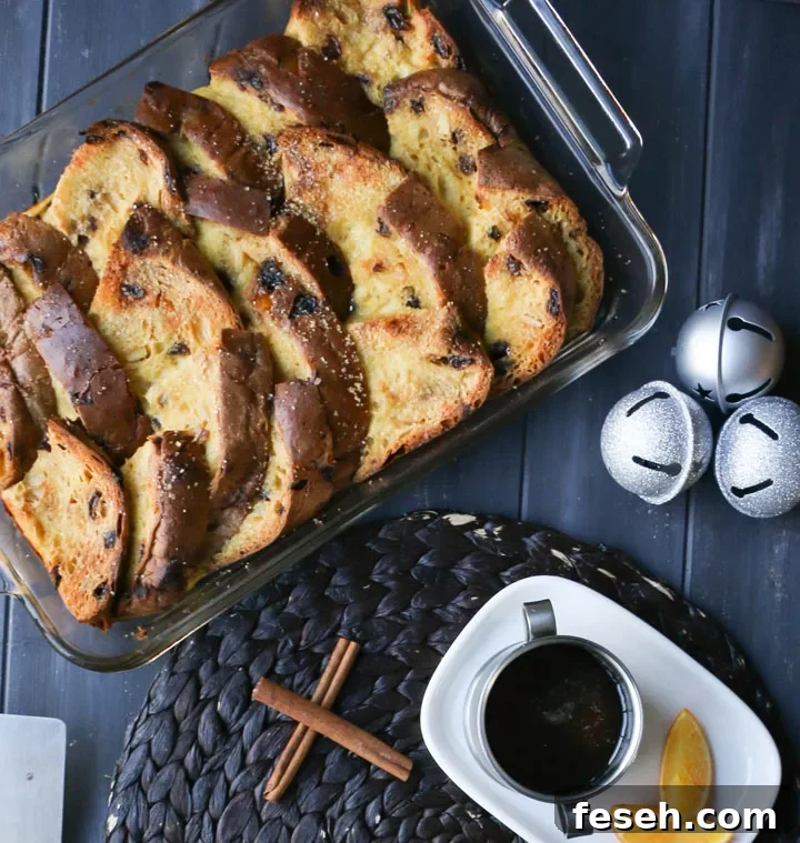 overindividual serving of baked french toast on a white platehead view of a full baking pan of overnight panettone French toast after its baked