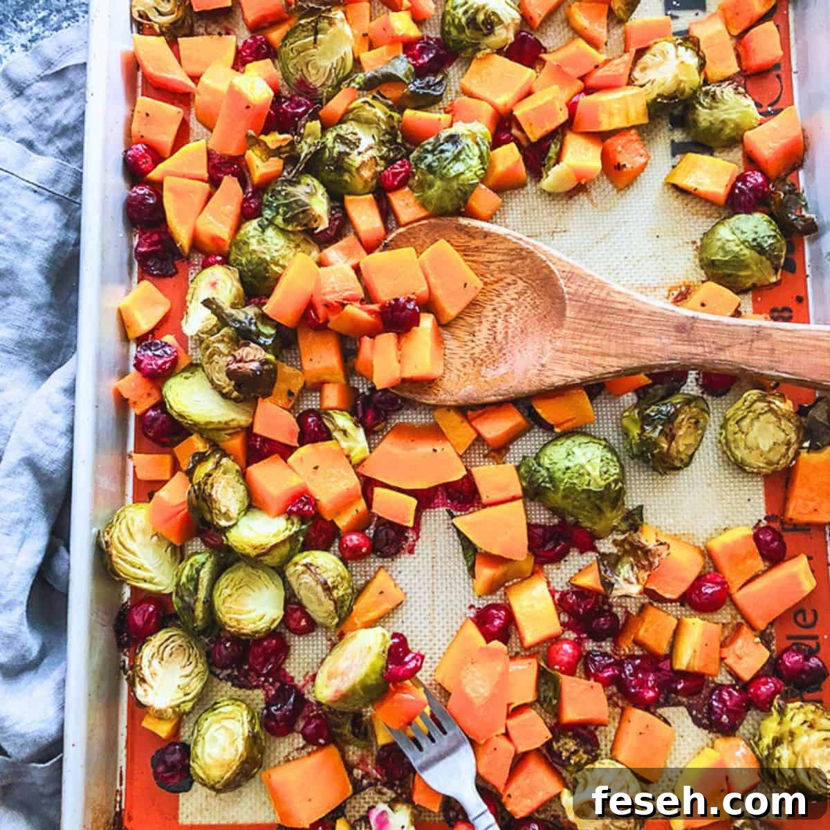 Are you looking for the easiest  Thanksgiving Side Dish ever? Try this dish for roasted brussels sprouts, butternut squash, and cranberries. 