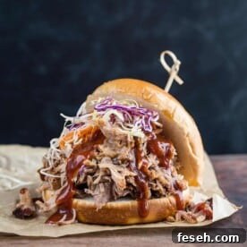A pulled pork sandwich made with easy smoked pulled pork