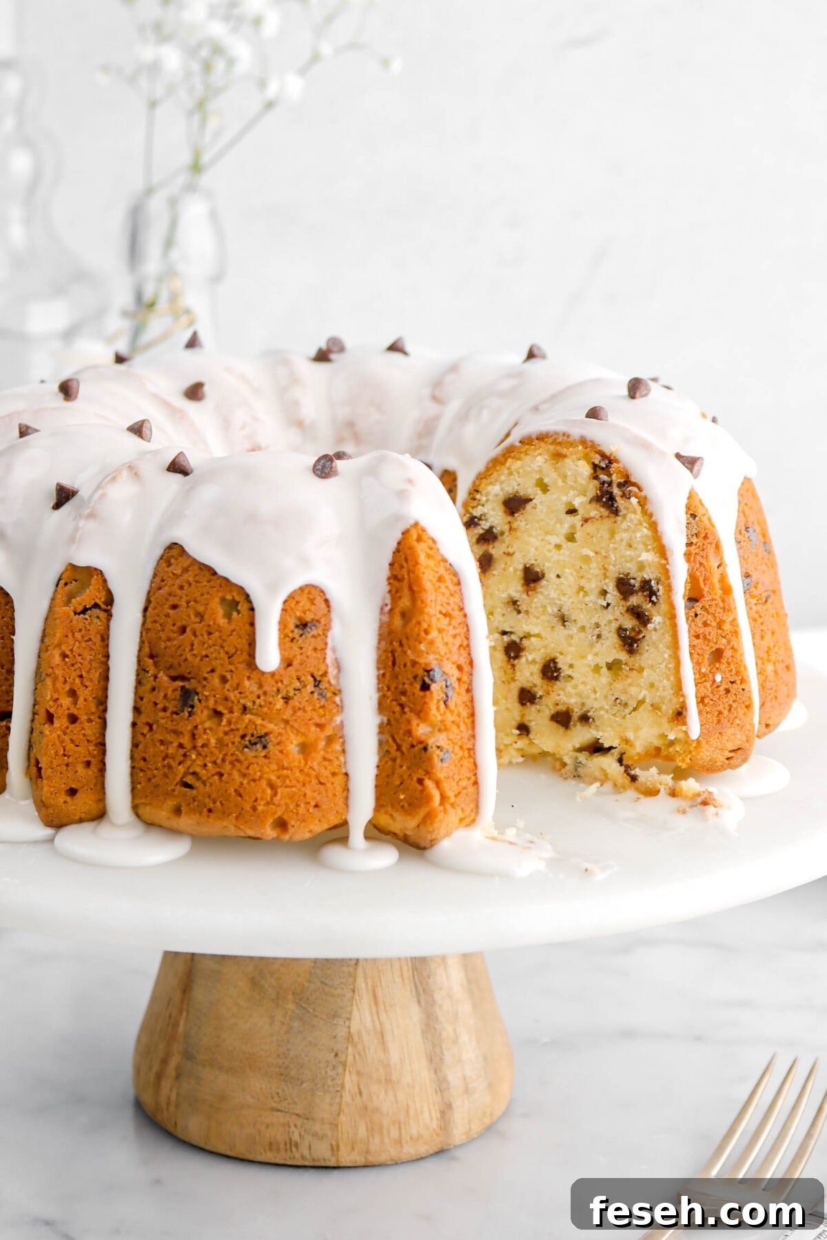 close up of chocolate chip pound cake with slice missing.