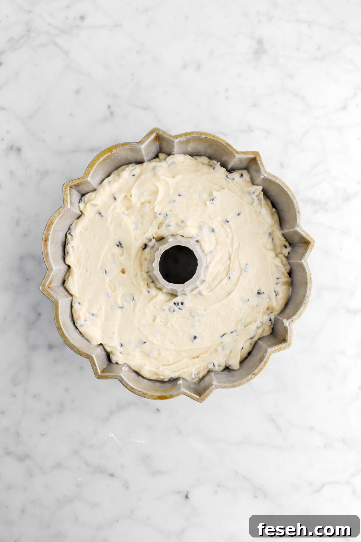 chocolate chip cake batter in bundt pan.