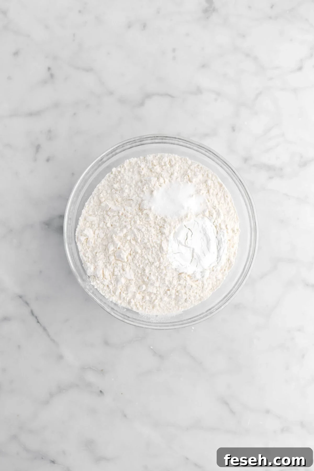flour, baking powder, and salt in glass bowl.