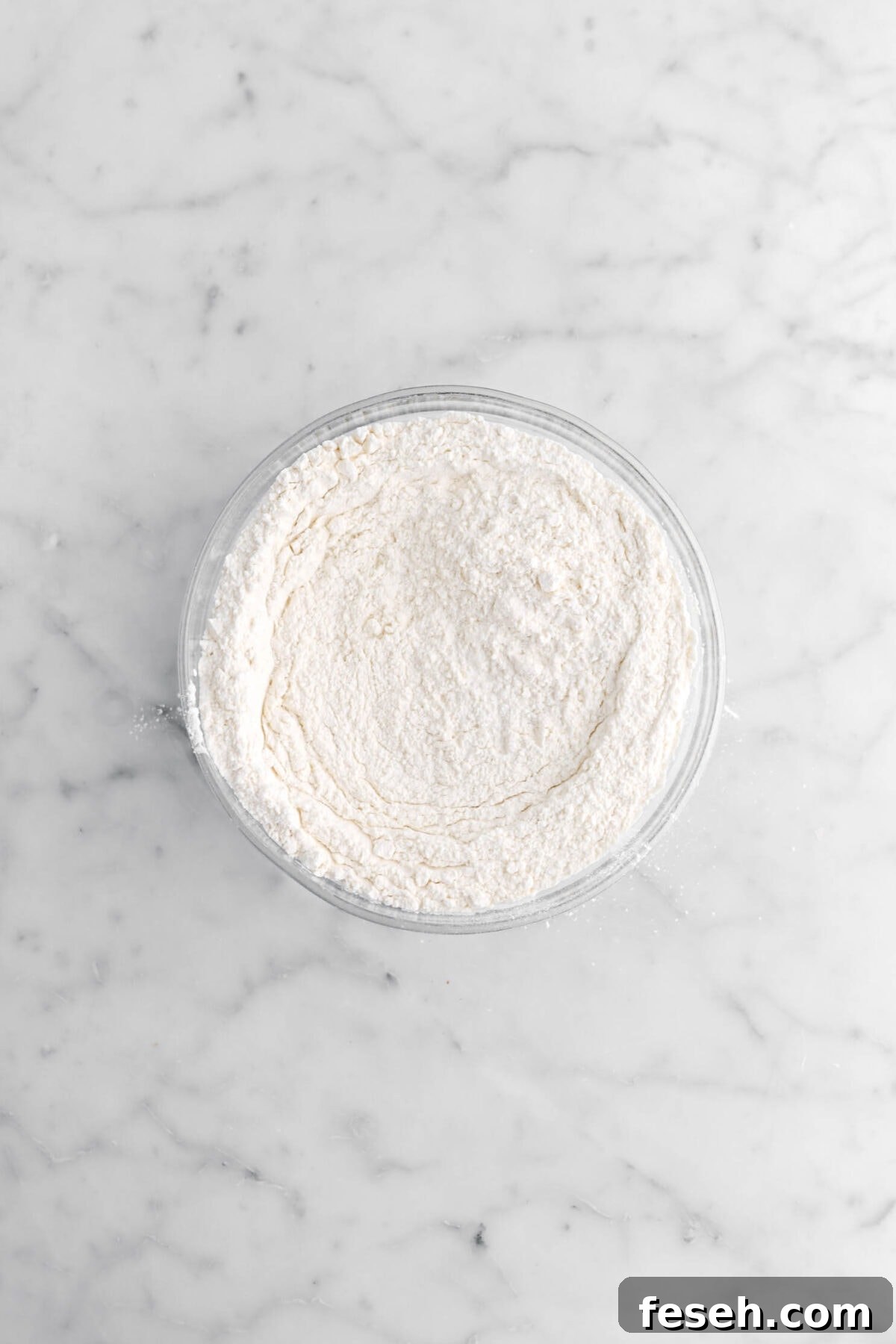 whisked dry ingredients in glass bowl.