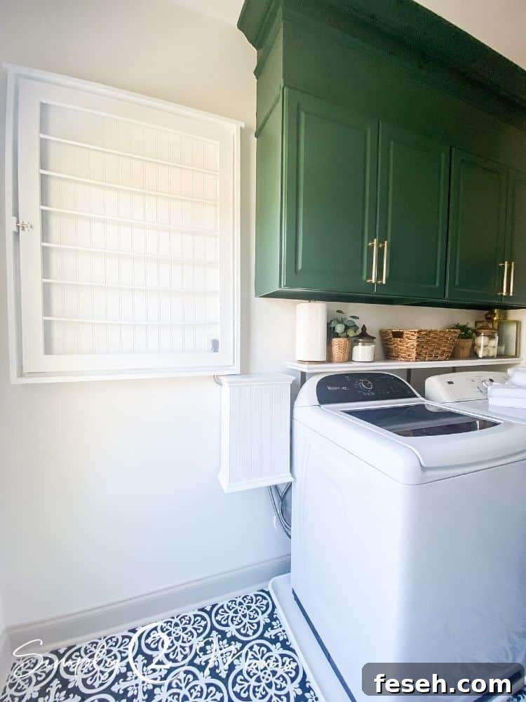 French country laundry room with a beadboard drying rack and painted laminate cabinets and a beadboard box to cover the washer hookup box that hides all hoses, plugs, and the hookup box.