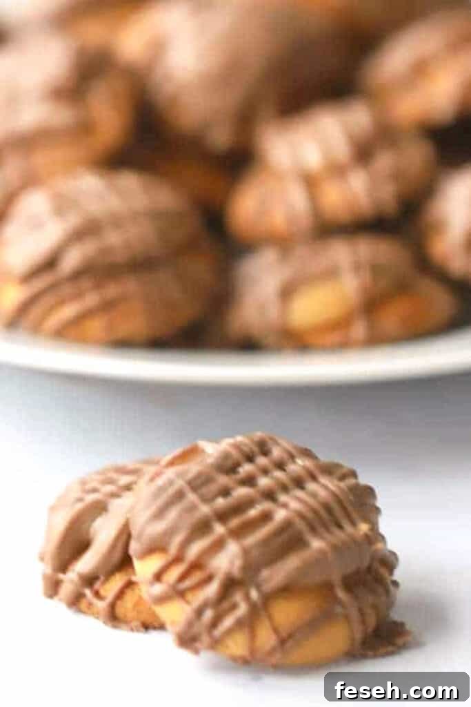 A stack of caramel and chocolate Nilla Wafers.