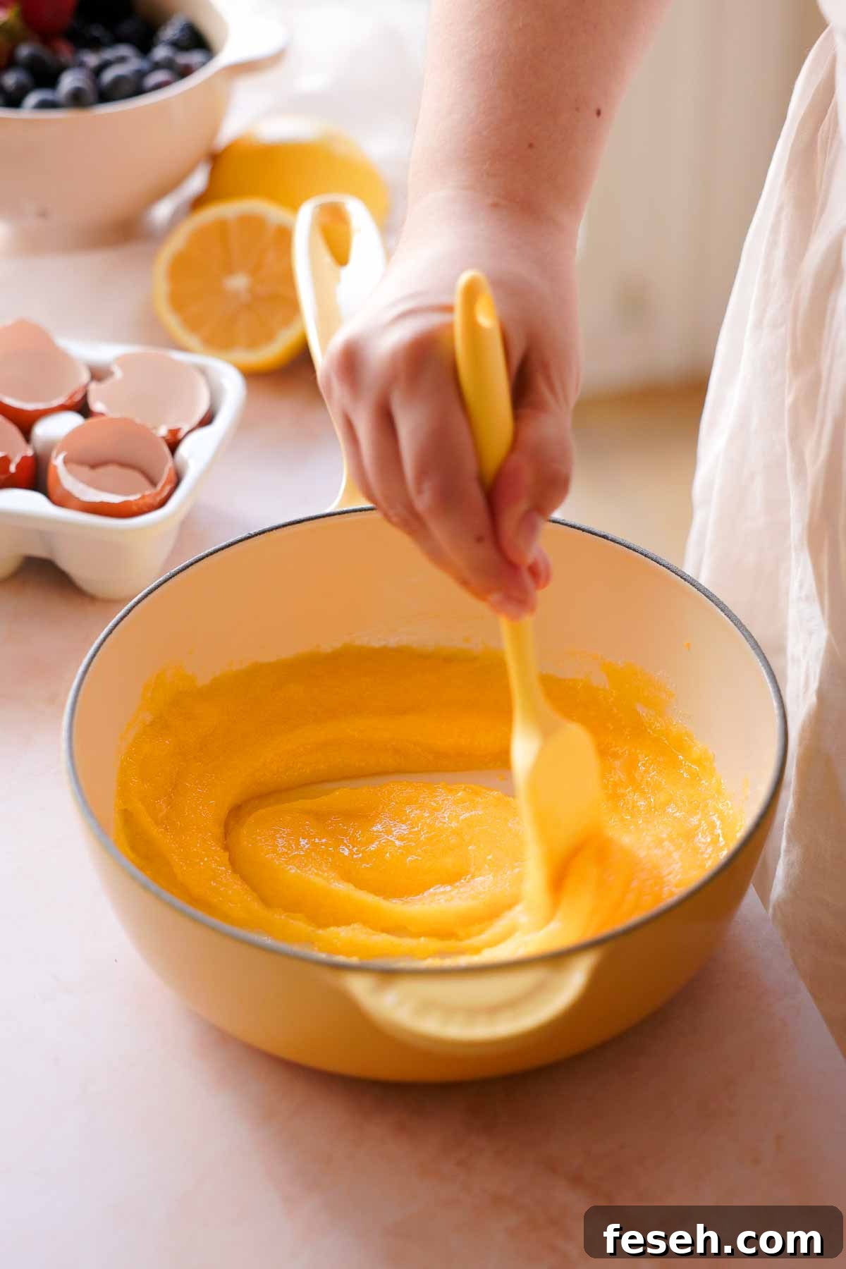 stirring together egg yolks and sugar