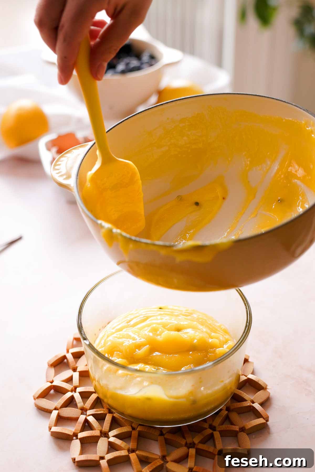 transferring passion fruit curd into glass container