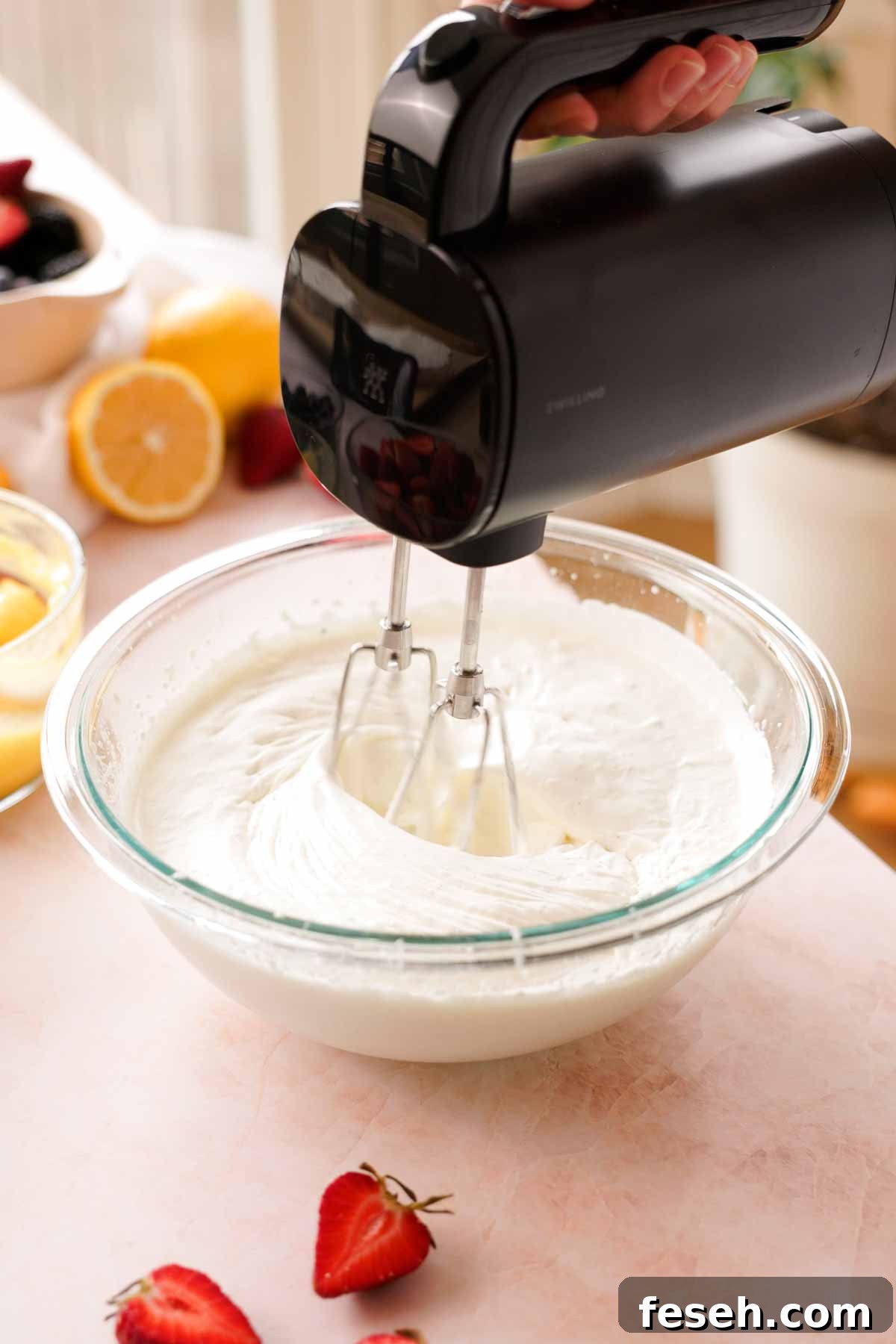 whipping cream to soft peaks in glass bowl