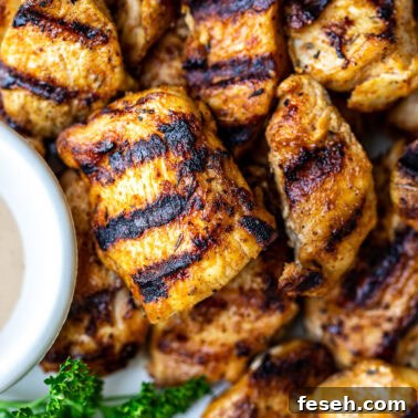 Chicken nuggets with grill marks.