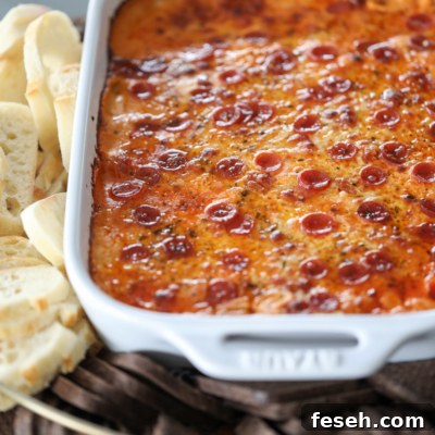 Be the winner at your next gathering with The Ultimate Sausage Pizza Dip!