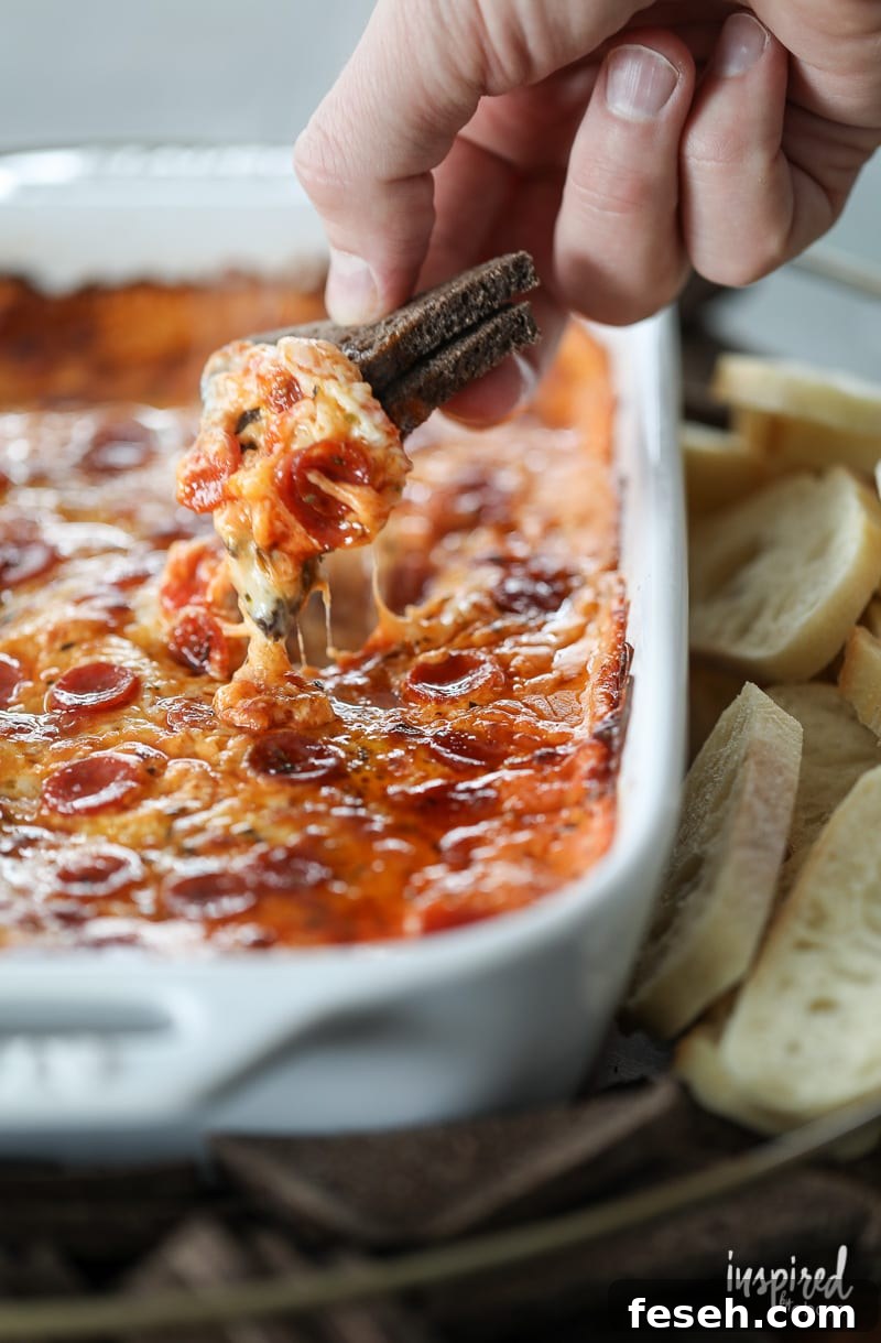 Be the winner at your next gathering with The Ultimate Sausage Pizza Dip!